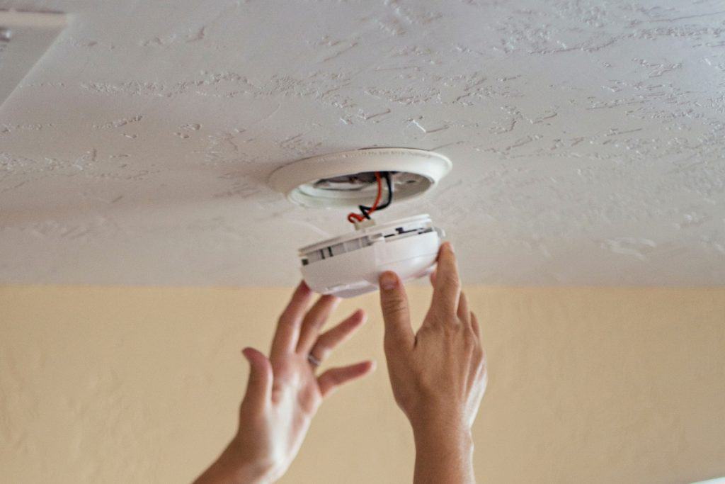 removing smoke alarm from housing